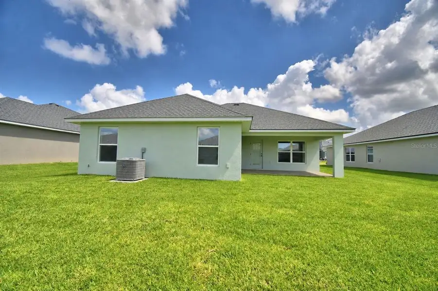 Exterior details and patio area of a home in Cadence Crossing, Auburndale (Image 3).
