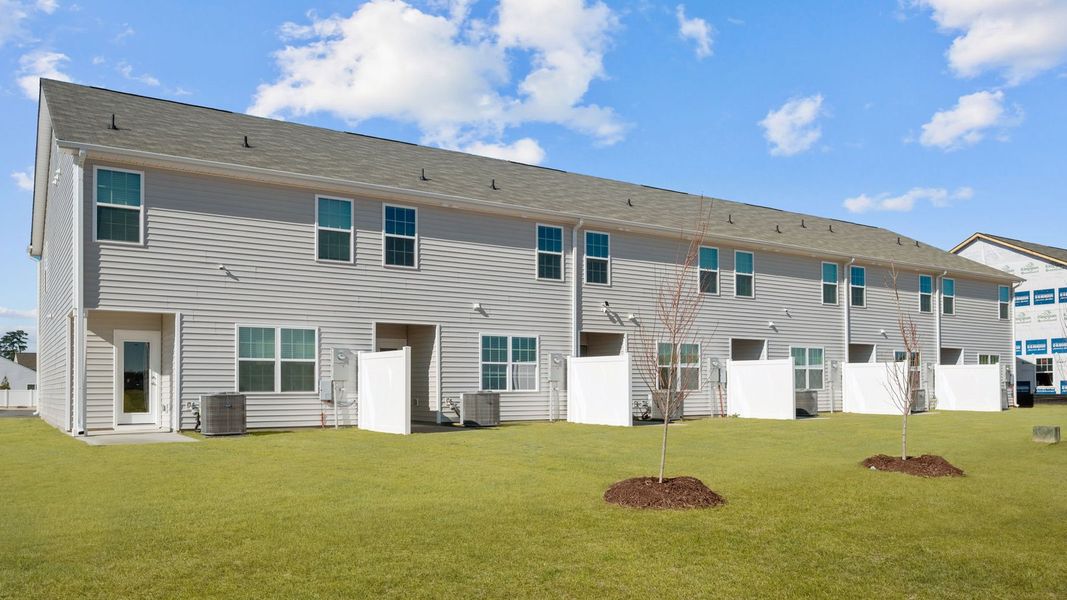 Exterior details and patio area of a home in The Townes at Ridgewood Farms, Winterville (Image 23).