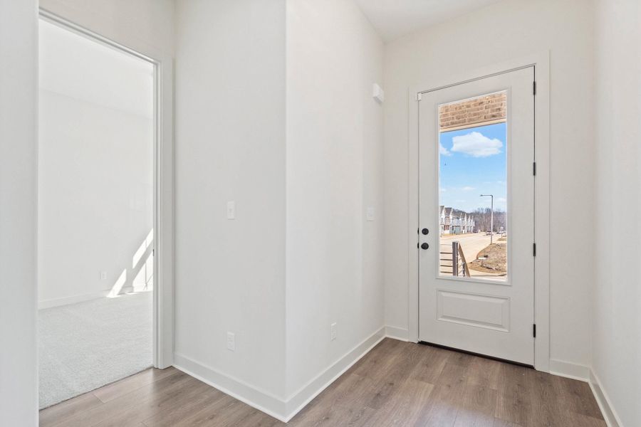 Doorway with wood finished floors