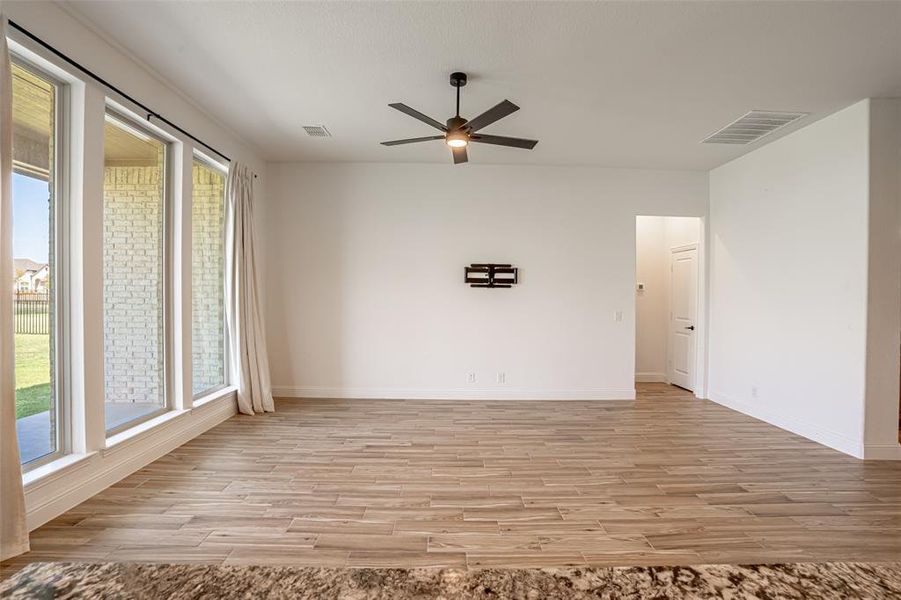 Large living room offers abundant natural light with large windows. Large living room offers abundant natural light with large windows.