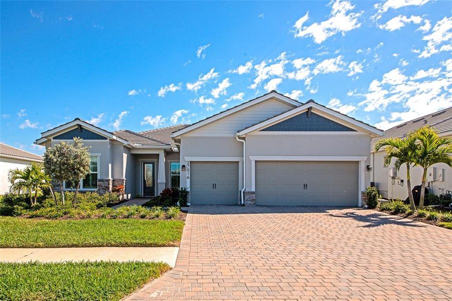 Front exterior of a new home in , Englewood, FL, highlighting curb appeal (Image 27). Front exterior of a new home in , Englewood, FL, highlighting curb appeal (Image 27).