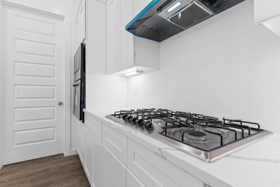 Kitchen features premium built-in appliances for a seamless design.