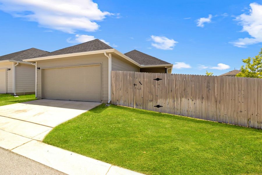 View of front of property with a garage, driveway, and roof with shingles View of front of property with a garage, driveway, and roof with shingles