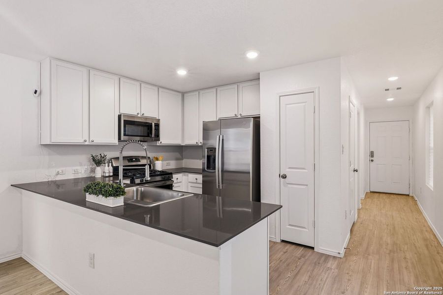 Furnished interior view inside a new home in Aston Park: Wellton Collection, San Antonio (Image 10).