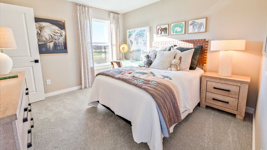 Bedroom with carpet and window