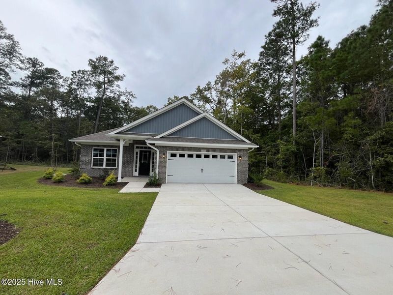 Front exterior of a new home in Palmetto Creek, Bolivia, NC, highlighting curb appeal (Image 2).