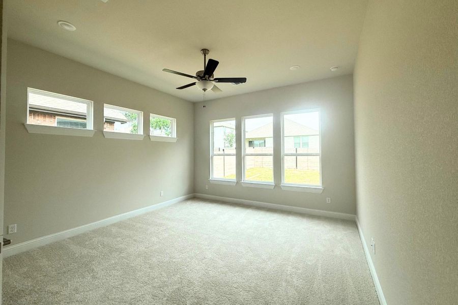 Spacious room featuring neutral carpeting, a ceiling fan, and recessed lighting Spacious room featuring neutral carpeting, a ceiling fan, and recessed lighting