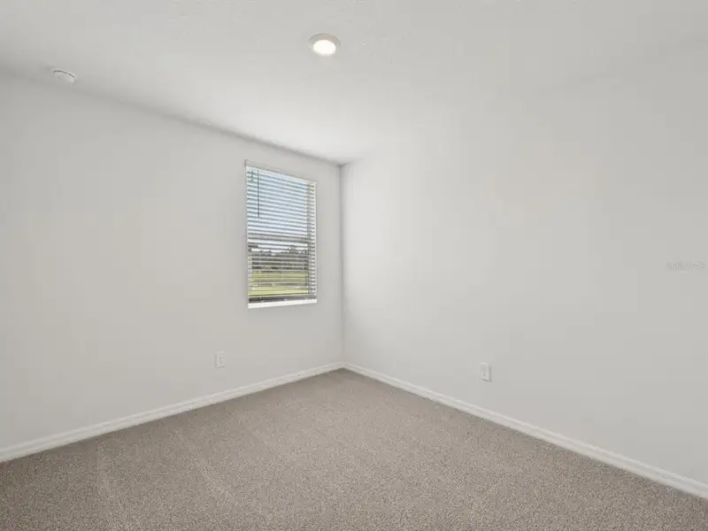 Spacious, unfurnished interior of a new home in The Reserve at Van Oaks, Auburndale (Image 24).