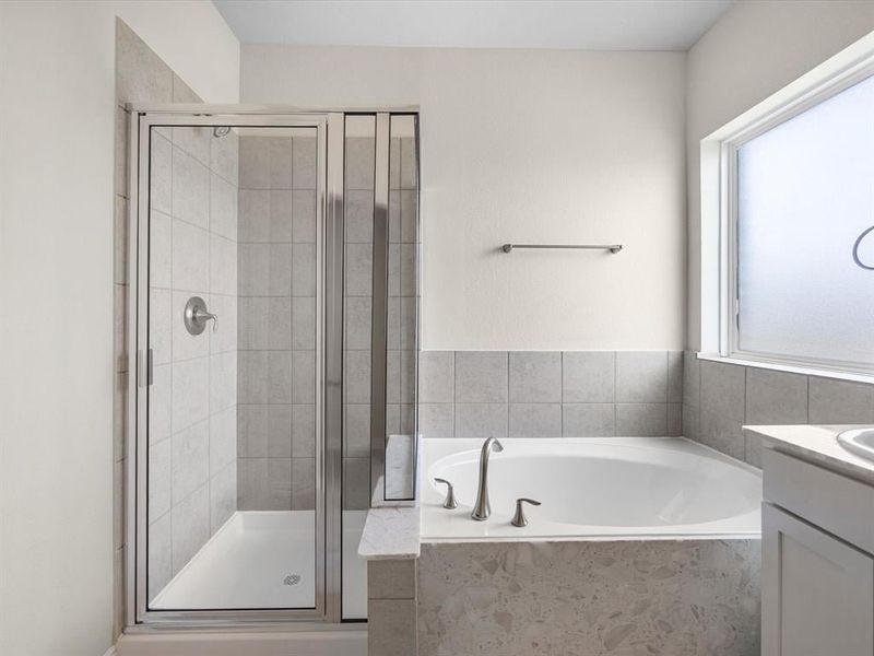 A bathroom with a glass shower. A bathroom with a glass shower.