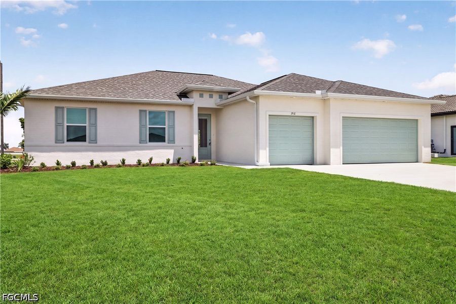 Front exterior of a new home in Cape Coral, Cape Coral, FL, highlighting curb appeal (Image 2). Front exterior of a new home in Cape Coral, Cape Coral, FL, highlighting curb appeal (Image 2).