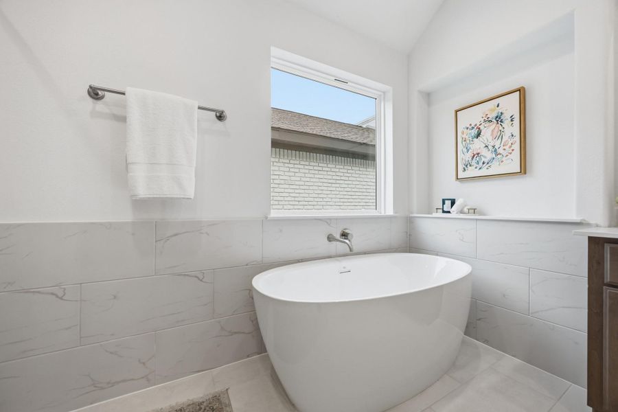 Soak in Serenity: End your days or start your weekends enveloped in the embrace of a luxurious soaking tub in this exquisitely designed primary bathroom.