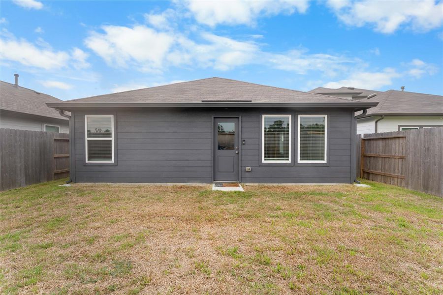 Spacious backyard with room to create your own outdoor setup and enjoy the extra space.