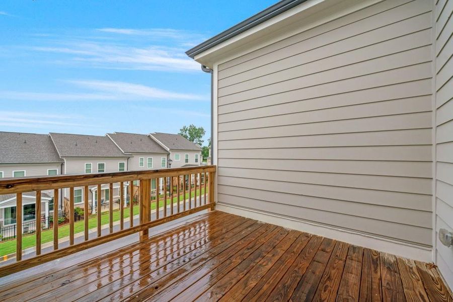 Exterior details and patio area of a home in Millcroft Townhomes, Buford (Image 4).