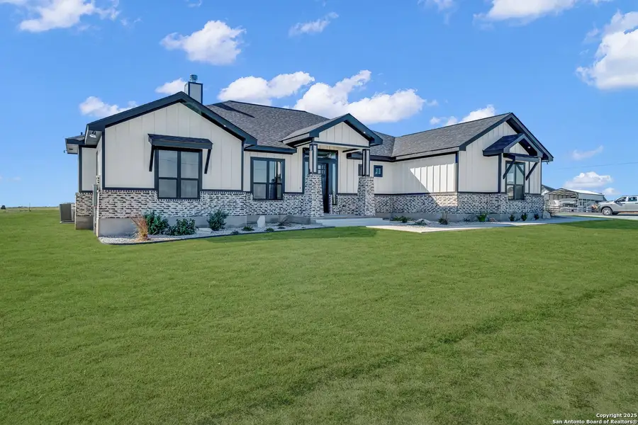 Front exterior of a new home in , La Vernia, TX, highlighting curb appeal (Image 2).