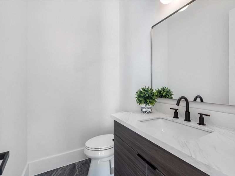Enjoy the convenience of a downstairs powder bath- bringing the total to 2.5 baths on the first floor, an uncommon feature in the heart of the city.