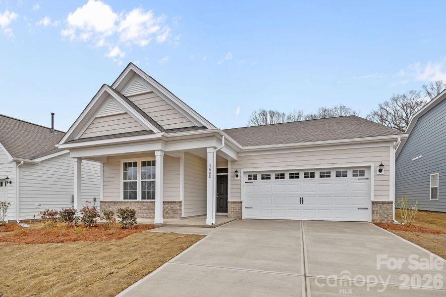 Front exterior of a new home in Cottages at Wingate, Wingate, NC, highlighting curb appeal (Image 17).