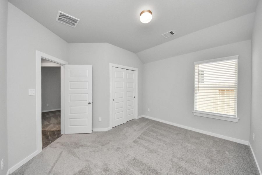 Generously sized secondary bedrooms featuring spacious closets, soft and inviting carpeting underfoot, large windows allowing plenty of natural light, and the added touch of privacy blinds for your personal retreat. Generously sized secondary bedrooms featuring spacious closets, soft and inviting carpeting underfoot, large windows allowing plenty of natural light, and the added touch of privacy blinds for your personal retreat.