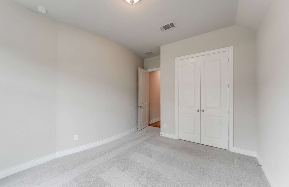Representative unfurnished interior of a home built from the 3049 by Ravenna Homes in The Woodlands Hills 65′, Willis (Image 35). Representative unfurnished interior of a home built from the 3049 by Ravenna Homes in The Woodlands Hills 65′, Willis (Image 35).