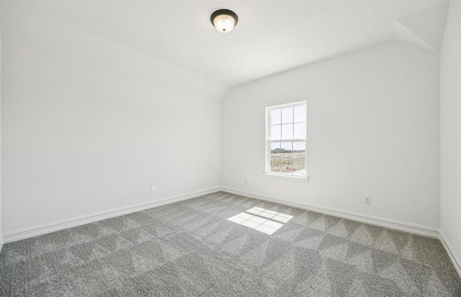 Spacious secondary bedroom with large window Spacious secondary bedroom with large window