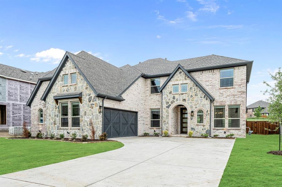 Front exterior of a new home in Devonshire Classic 60-65, Forney, TX, highlighting curb appeal (Image 2). Front exterior of a new home in Devonshire Classic 60-65, Forney, TX, highlighting curb appeal (Image 2).