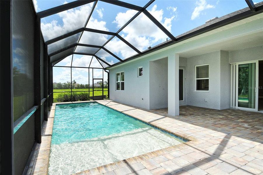 Front exterior of a new home in Canoe Creek, Parrish, FL, highlighting curb appeal (Image 25).
