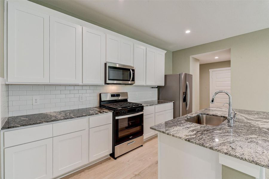 Furnished interior view inside a new home in Post Oak Pointe, Fresno (Image 9).