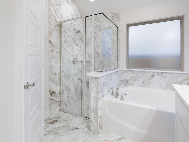 Bathroom with vanity and independent shower and bath