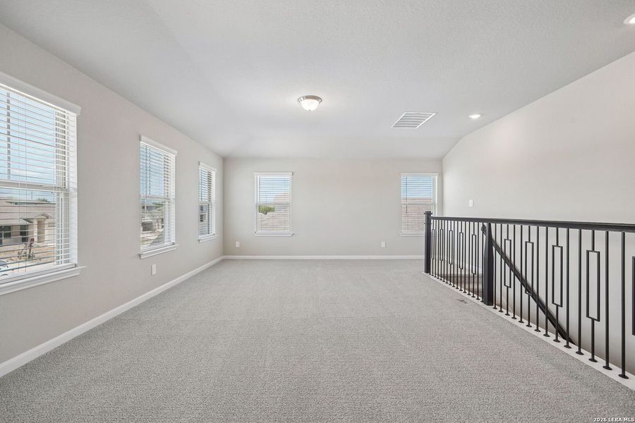Spacious, unfurnished interior of a new home in Remington Ranch, San Antonio (Image 42).