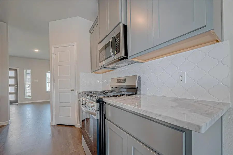 Furnished interior view inside a new home in Mill Creek Trails, Magnolia (Image 10).