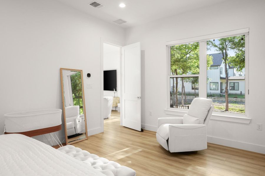 Luxury vinyl plank flooring runs throughout the primary bedroom and upstairs for easy upkeep. Luxury vinyl plank flooring runs throughout the primary bedroom and upstairs for easy upkeep.