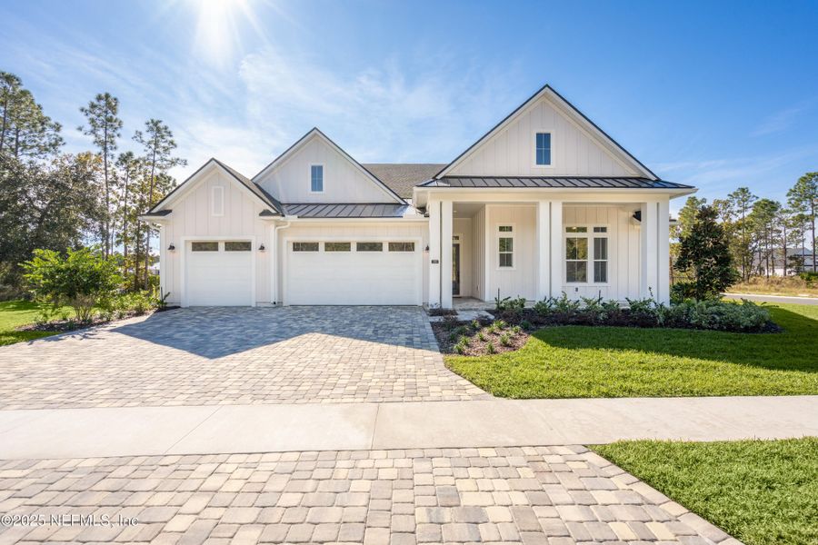Front exterior of a new home in SilverLeaf, St. Augustine, FL, highlighting curb appeal (Image 1). Front exterior of a new home in SilverLeaf, St. Augustine, FL, highlighting curb appeal (Image 1).