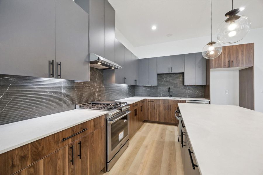 Sleek kitchen workspace with stainless appliances and extended counter space