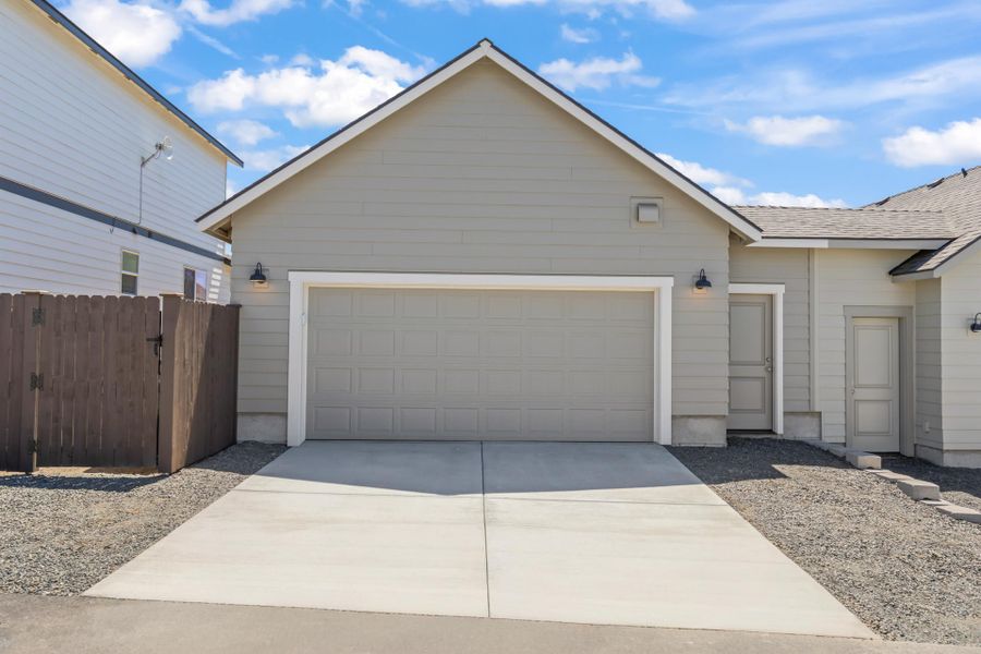 Front exterior of a new home in Feather Ridge, Redmond, OR, highlighting curb appeal (Image 25).