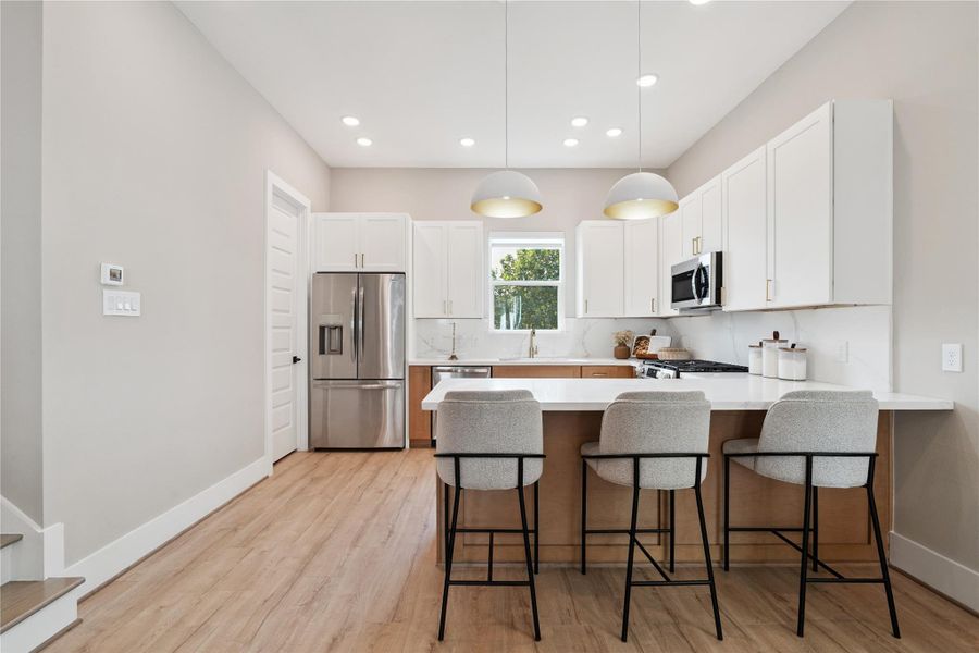 Welcome to Griggs Landing built by Prosperity Homes—a 12-home gated development where architectural form meets function. This kitchen anchors the home with bold lines, sleek materials, and a layout designed for modern living.
