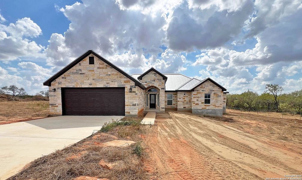 Front exterior of a new home in , St. Hedwig, TX, highlighting curb appeal (Image 1). Front exterior of a new home in , St. Hedwig, TX, highlighting curb appeal (Image 1).