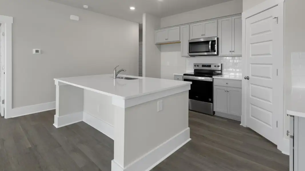 Furnished interior view inside a new home in The Retreat at Indigo Preserve Townhomes, Leland (Image 7).