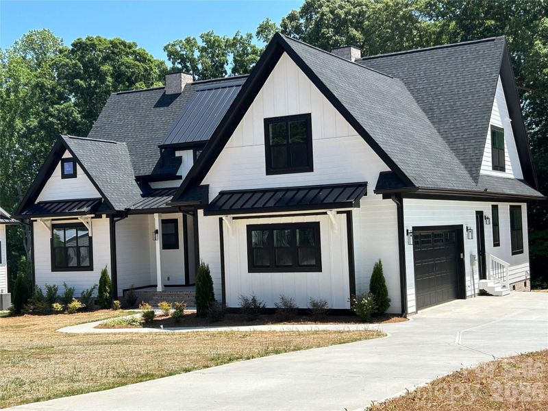 Front exterior of a new home in , Mooresville, NC, highlighting curb appeal (Image 2). Front exterior of a new home in , Mooresville, NC, highlighting curb appeal (Image 2).