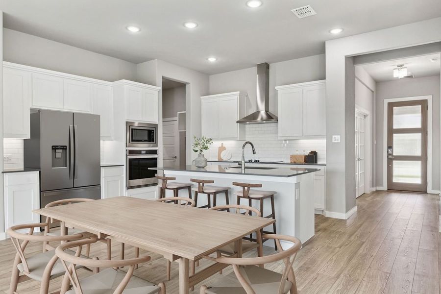 Kitchen in the Bowie home plan by Trophy Signature Homes – REPRESENTATIVE PHOTO Kitchen in the Bowie home plan by Trophy Signature Homes – REPRESENTATIVE PHOTO
