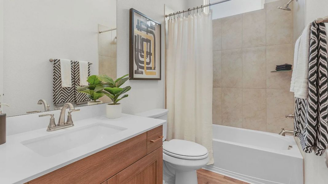Representative furnished interior of a home built from the Lauren by Chesmar Homes in University Heights, Round Rock (Image 5).