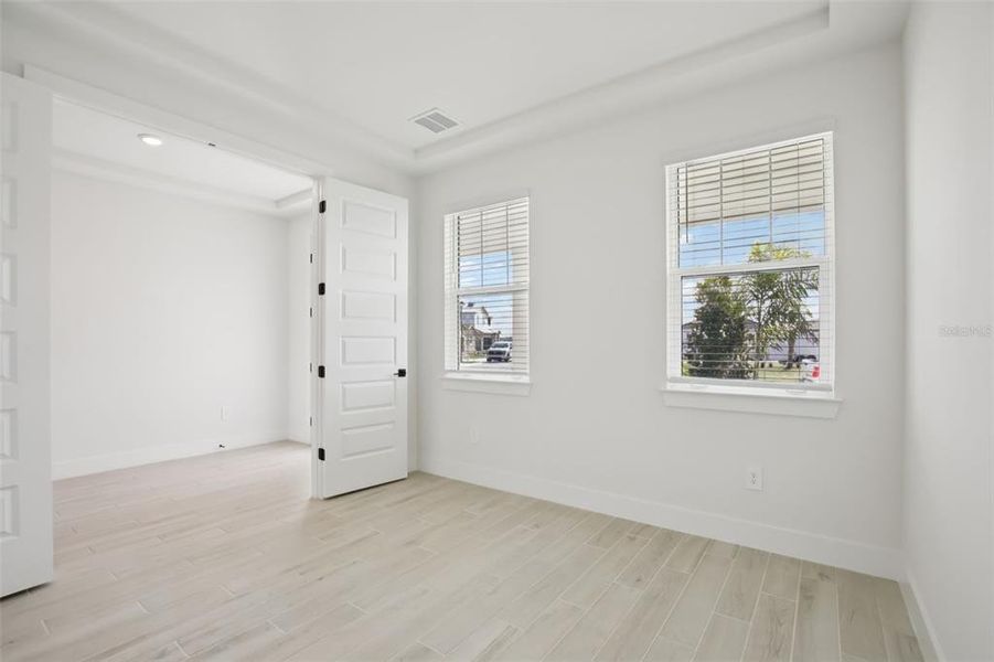 Spacious, unfurnished interior of a new home in Magnolia Bay - Reserve Series, Nokomis (Image 21).