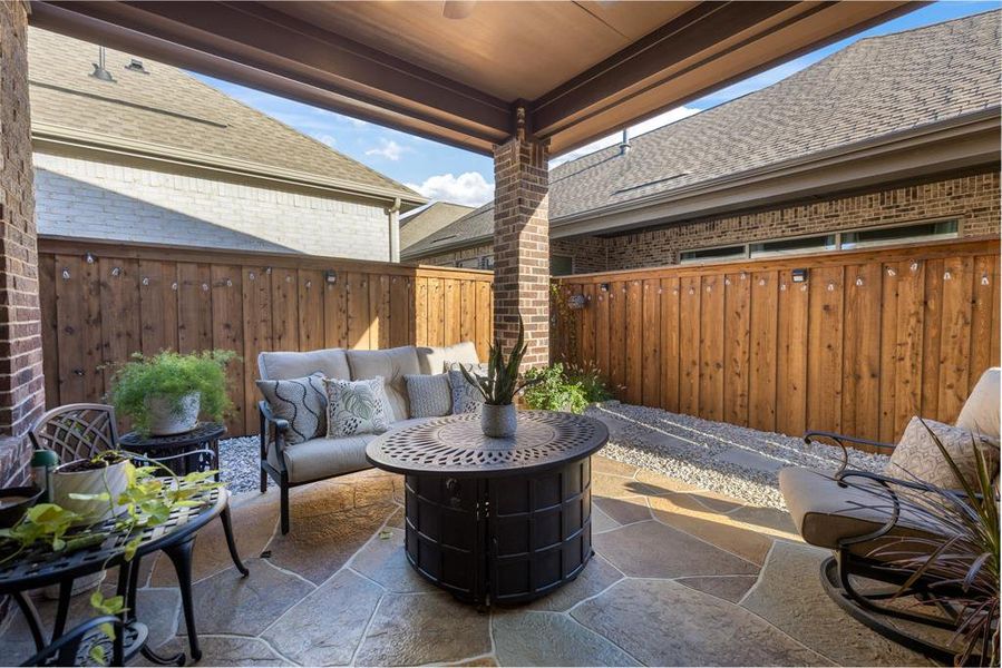 Fenced backyard with a patio and an outdoor living space Fenced backyard with a patio and an outdoor living space