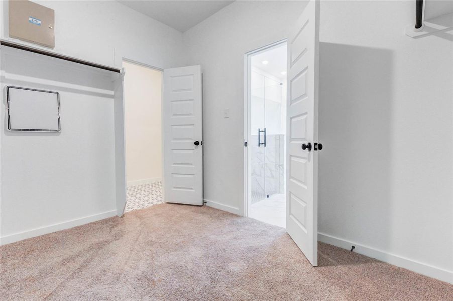 Large walk-in closet offering ample storage and organization space.