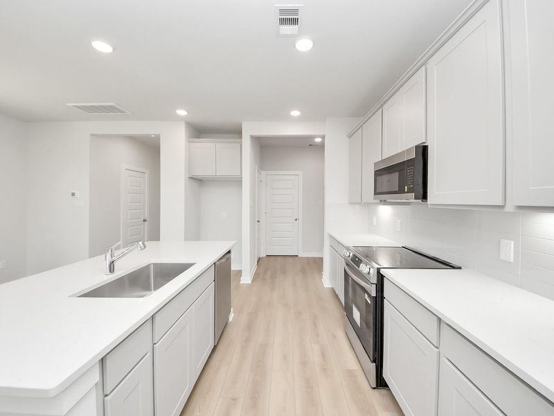 Furnished interior view inside a new home in Spring Branch Crossing, Conroe (Image 7).