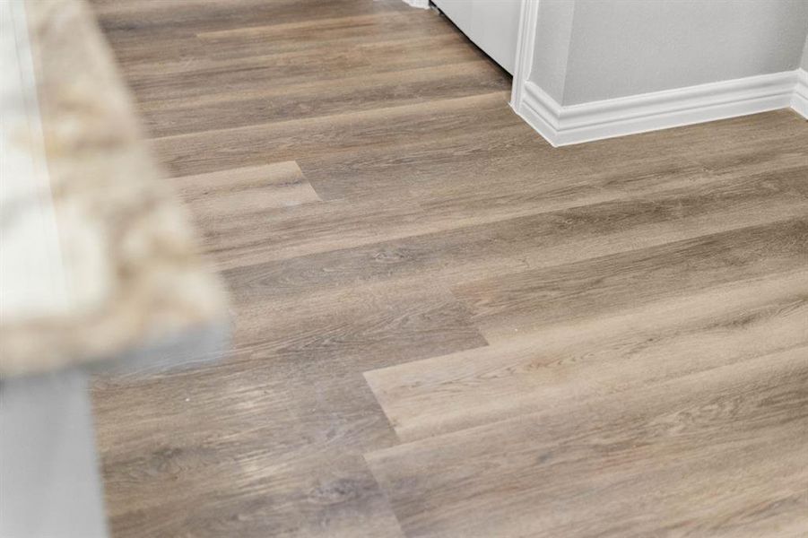 Nice laminate flooring throughout the home.