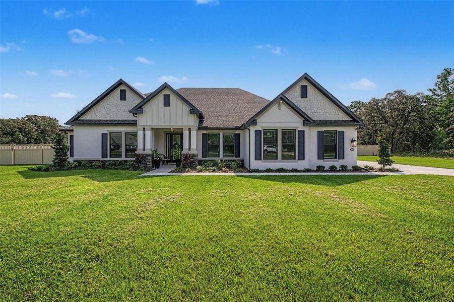 Front exterior of a new home in , Hudson, FL, highlighting curb appeal (Image 22). Front exterior of a new home in , Hudson, FL, highlighting curb appeal (Image 22).