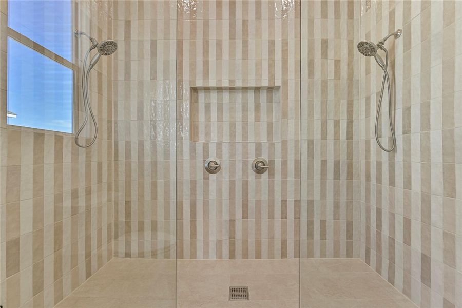 Huge step in shower with double rainshower heads. Huge step in shower with double rainshower heads.