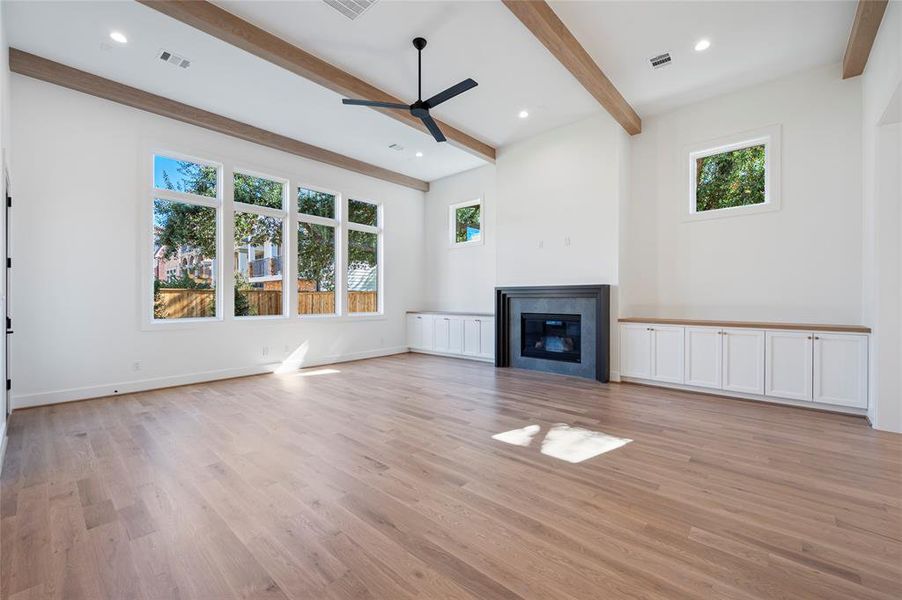 Huge great room with 13' ceiling and white oak wood beam ceiling detail