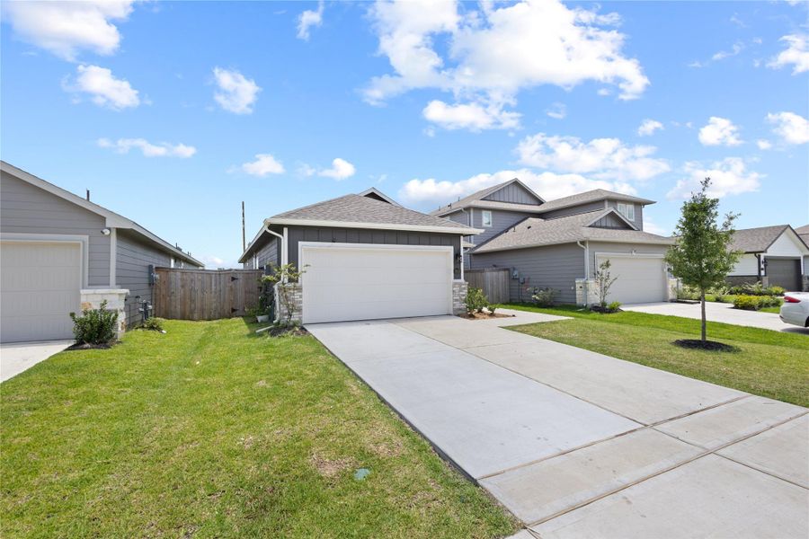 Front exterior of a new home in Sundance Cove - Traditional Series, Crosby, TX, highlighting curb appeal (Image 22).