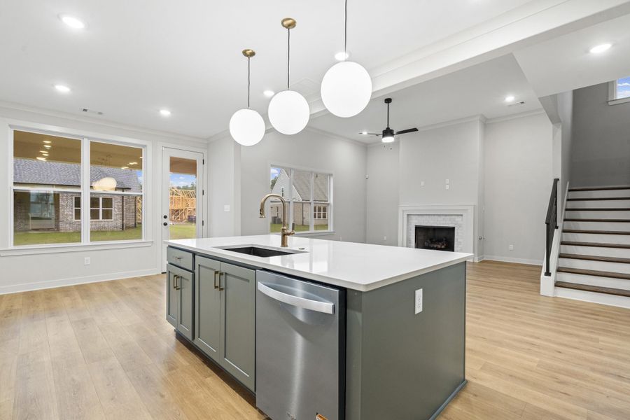 Kitchen island with an undermount sink and a stainless steel dishwasher Kitchen island with an undermount sink and a stainless steel dishwasher