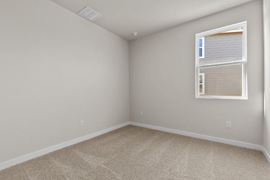 A room with a window and carpet. A room with a window and carpet.